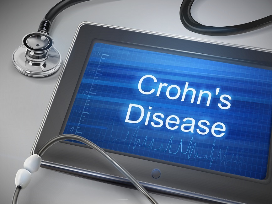 stethoscope and tablet with crohns disease on screen
