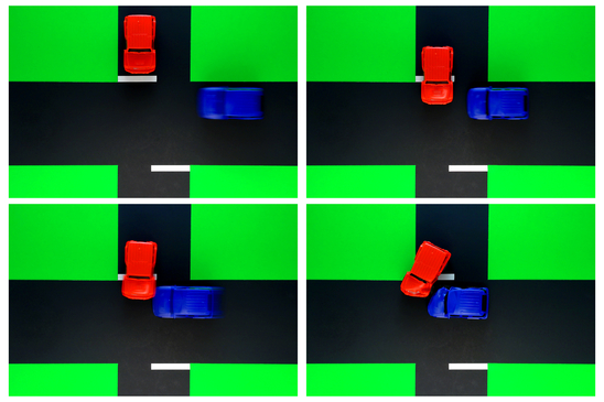 Driver ed classroom education board demonstration with toy cars of a crash at a road intersection with accident involving a red vehicle failing to yield and illegally running a stop sign while responsible for a dangerous collision with a blue automobile driving with right of way and subsequent auto body damage