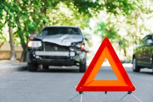 Red Emergency Stop Triangle Sign On Road During A Car Accident in Las Vegas area.