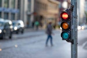 close image of stop light with red light illuminated
