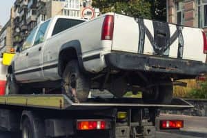 pickup truck being towed after accident
