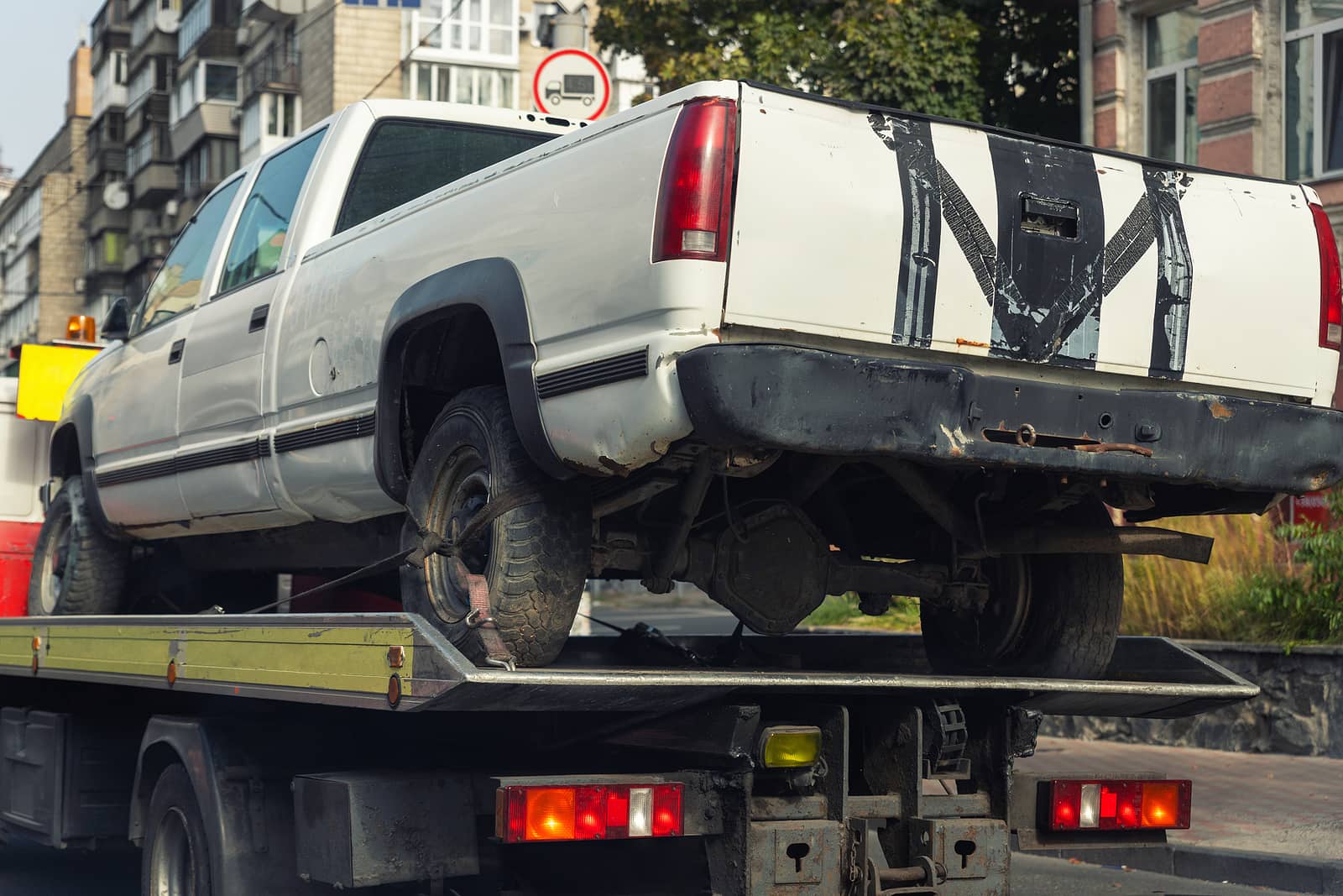 pickup truck being towed after accident