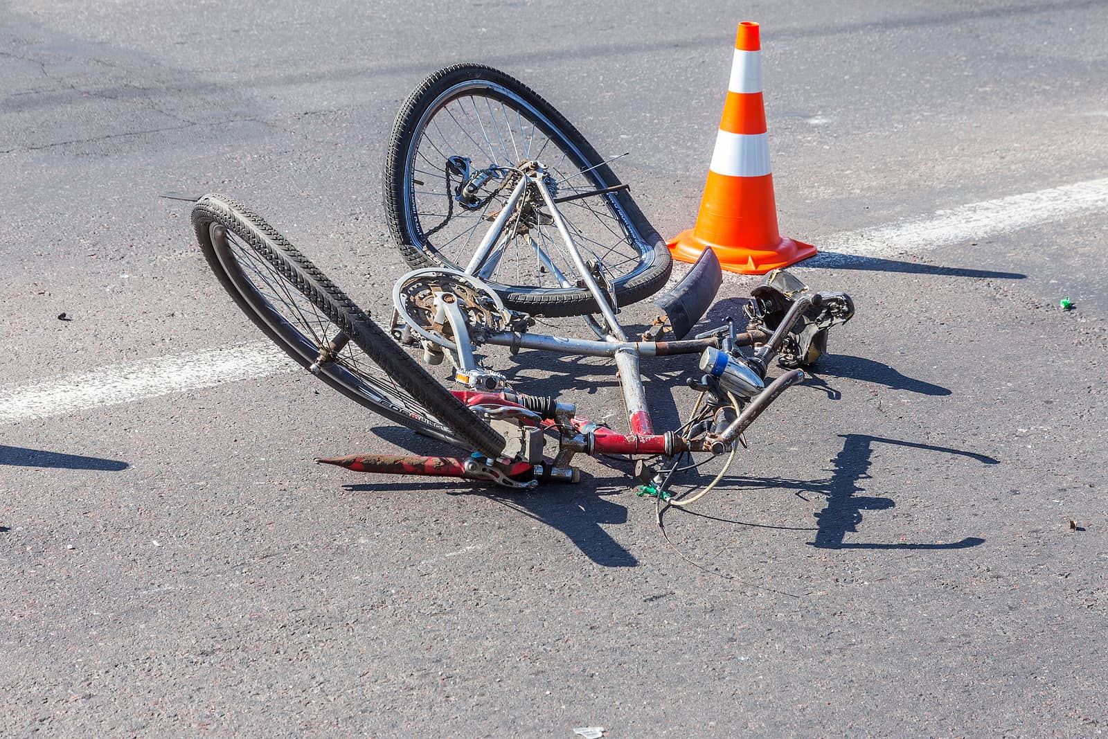 wrecked bicycle lying in Las Vegas street after being stuck by pickup truck