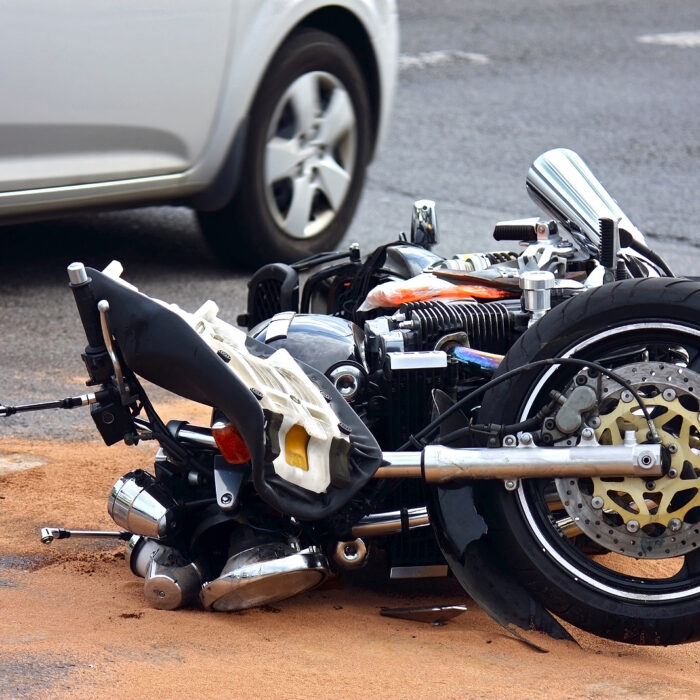 motorcycle lying in Las Vegas street after being struck by vehicle
