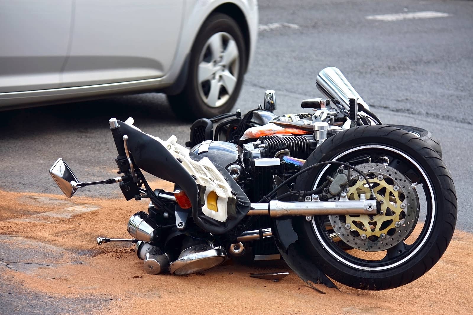 motorcycle lying in Las Vegas street after being struck by vehicle