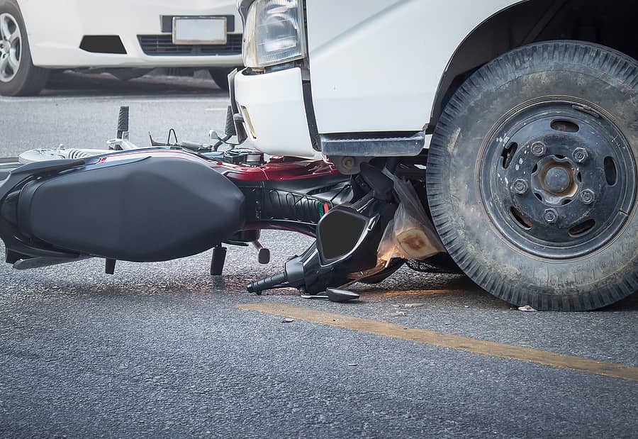 Motorcycle and truck involved in a crash