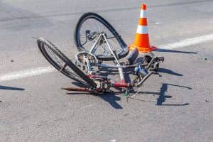 Damaged bike laying in the road after an accident