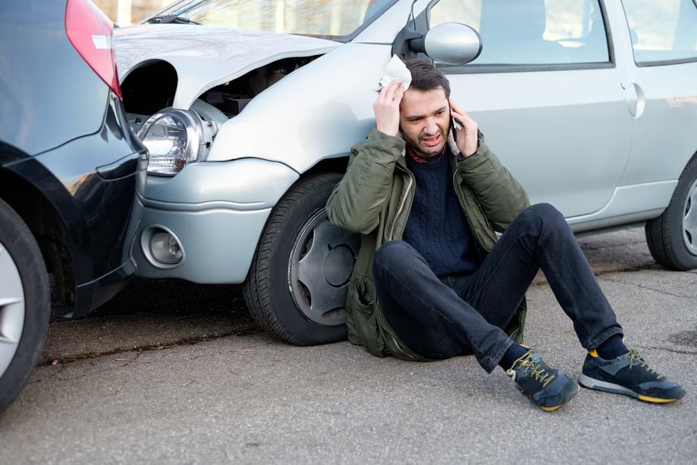 A man calling personal injury lawyer after experiencing a rear-end car accident in Las Vegas